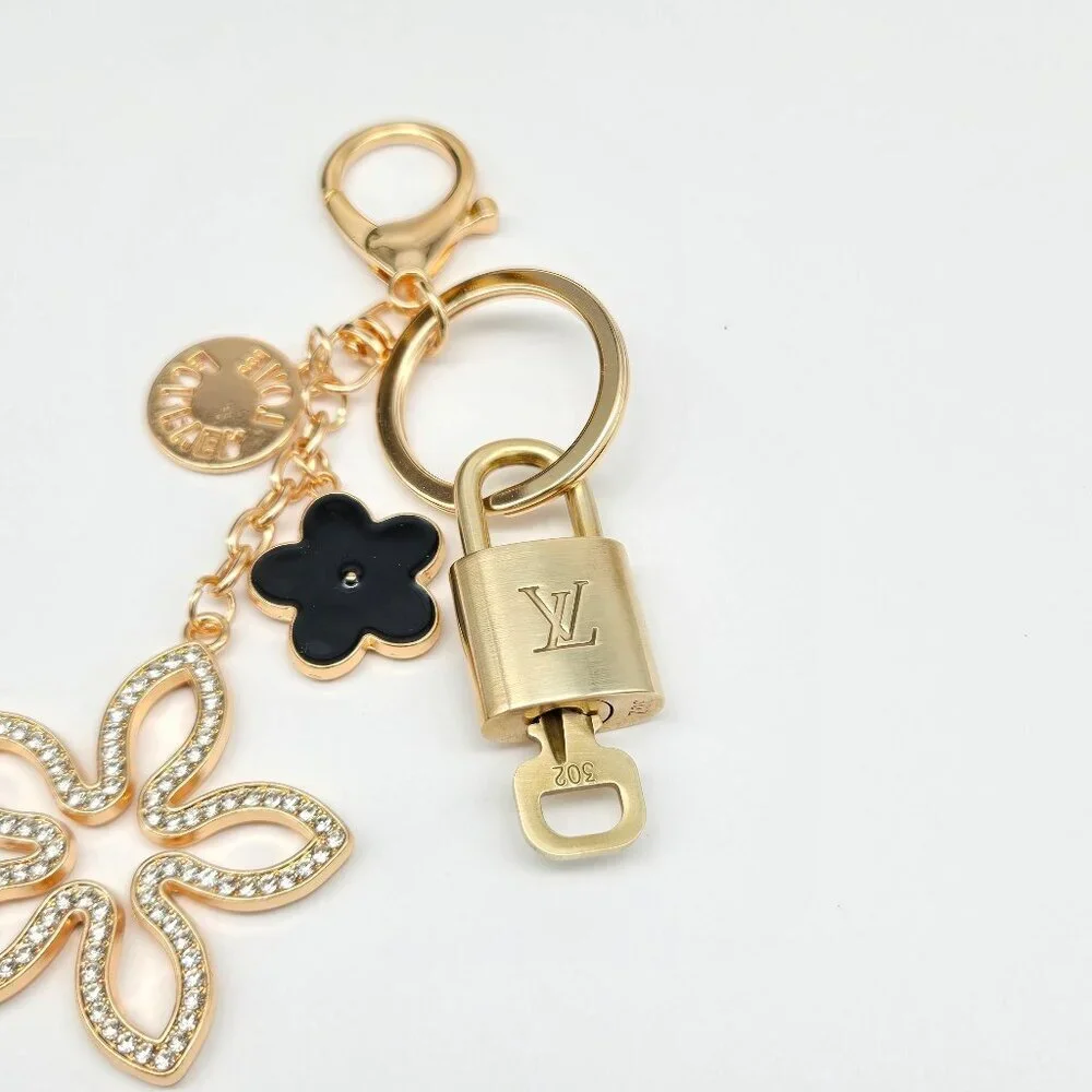 Louis Vuitton Gold-Tone Crystal Flower Keychain with Black Accent